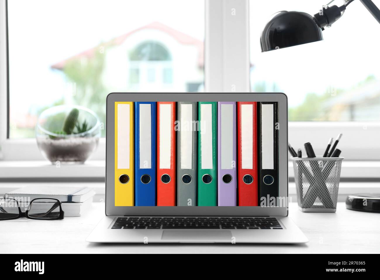 Store and organize information. Modern laptop with hardcover office