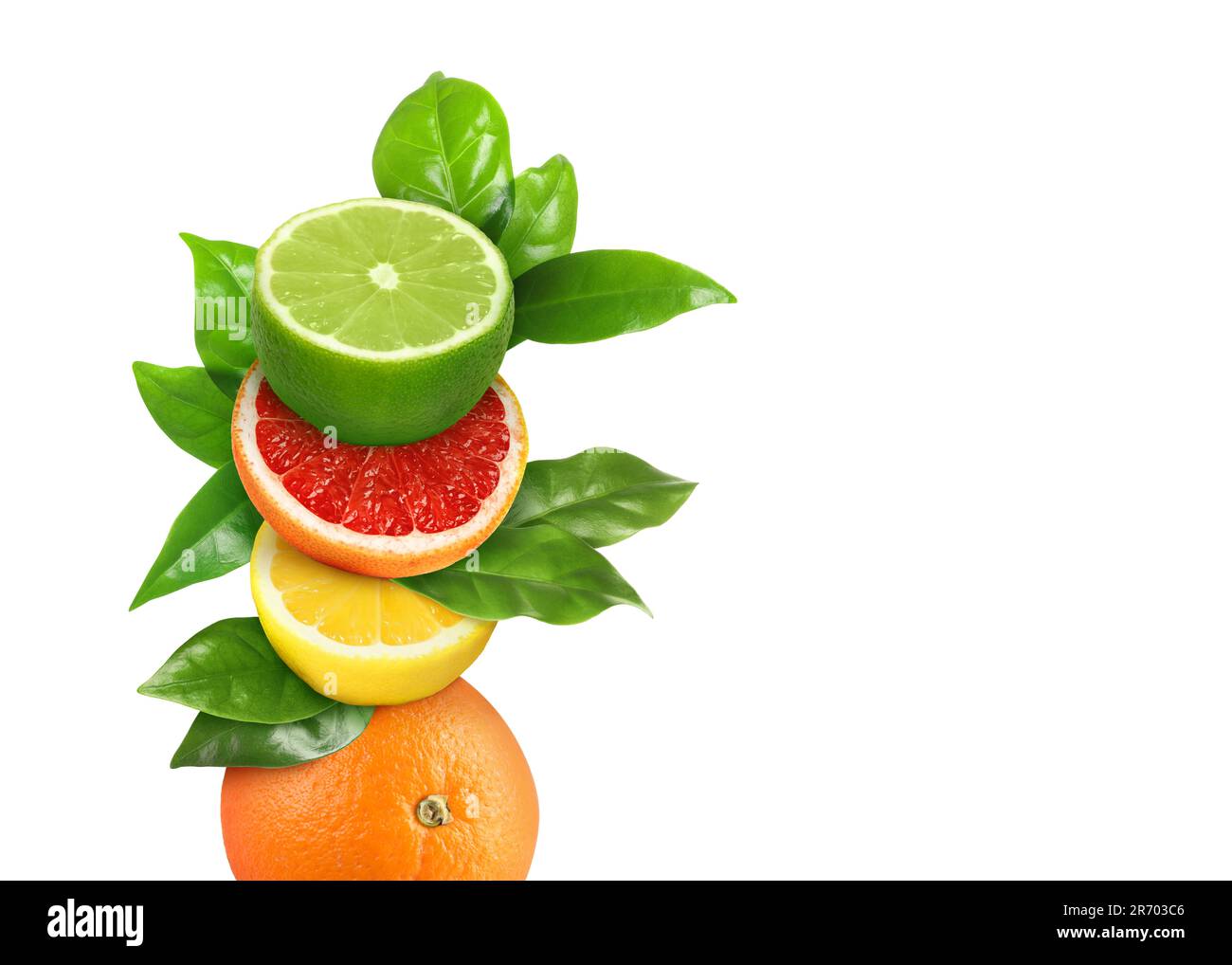 Stack of different fresh citrus fruits with green leaves on white background Stock Photo