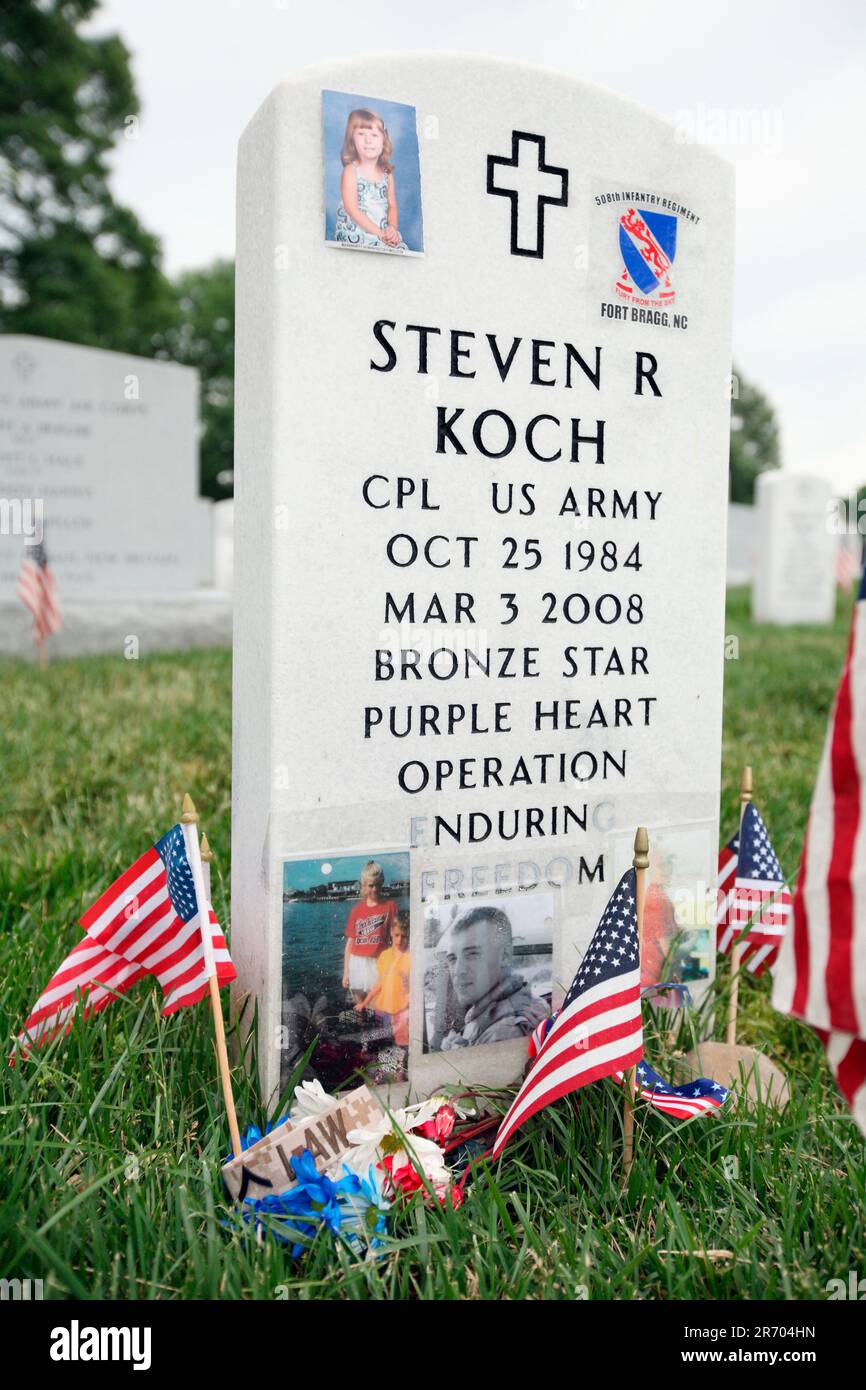 Grave sites of soldiers are decorated with memorabilia  at Arlington National Cemetery Stock Photo