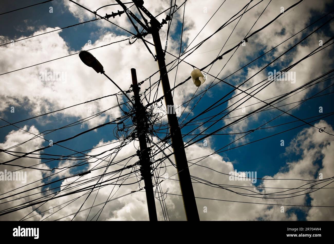 Tangled powerlines in a slum in Caracas, Venezuela  represent the energy crises causing blackouts across the country. Stock Photo