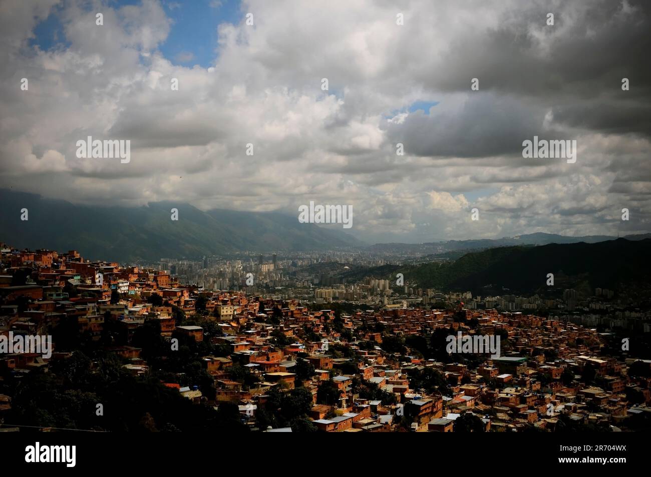A sweeping cityscape of Caracas, Venezuela under a cloudy sky. Stock Photo