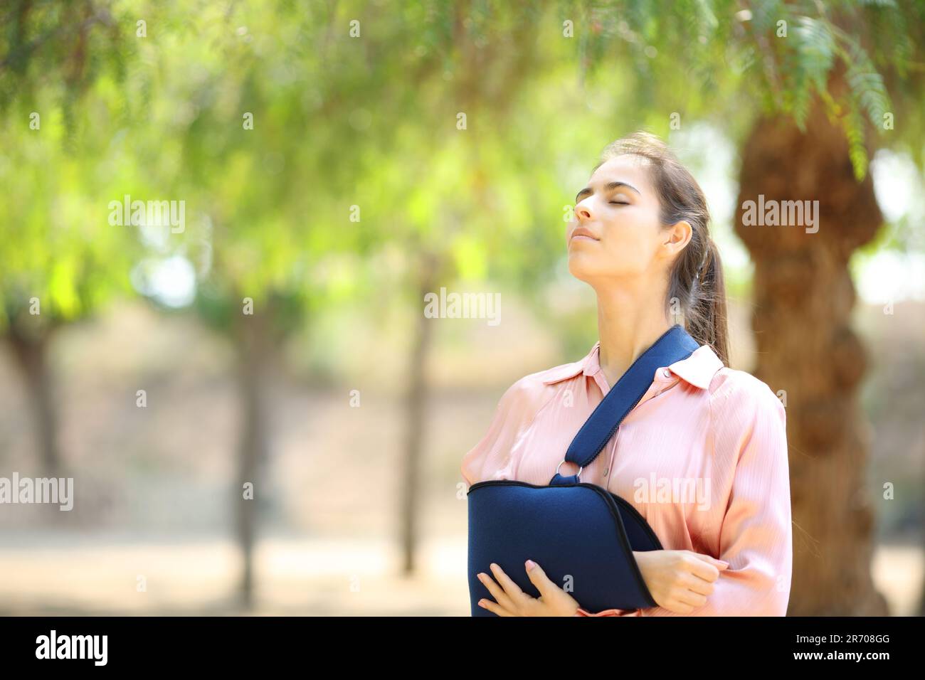 Convalescent woman breathing fresh air in a park Stock Photo - Alamy