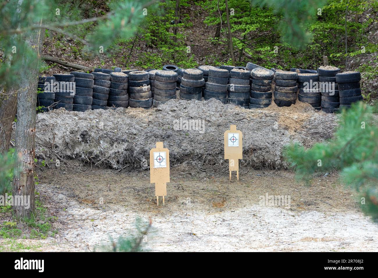 Wooden targets in a shooting range set up in a forest ravine. Stock Photo