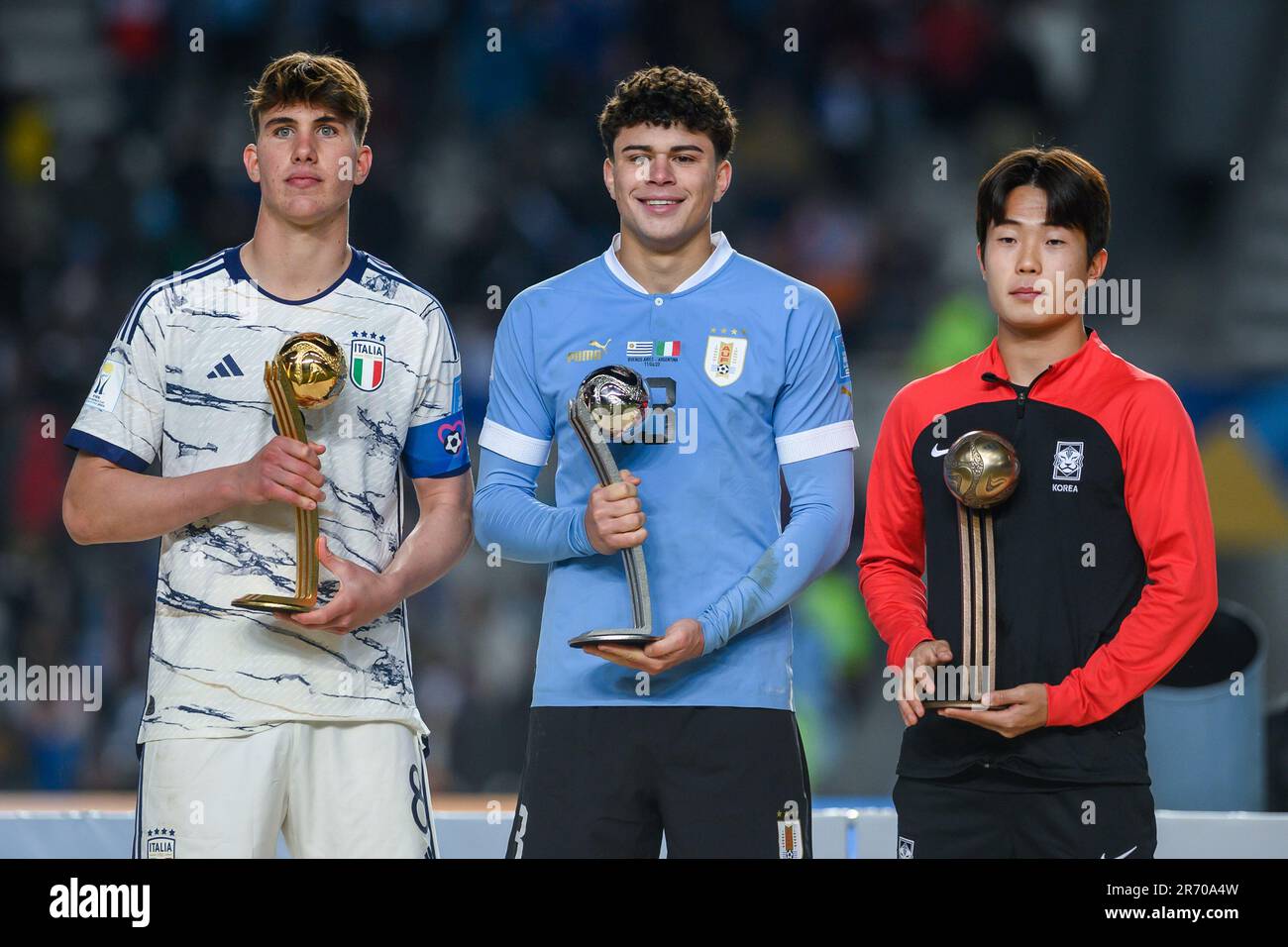 Cesare Casadei of Italy poses with the Adidas Golden Ball Trophy, Alan Matturro of Uruguay poses with the Adidas Silver Ball Trophy and Lee Seungwon poses with the Adidas Bronze Ball Trophy during the FIFA U-20 World Cup Argentina 2023 Final match between Italy and Uruguay at Estadio La Plata. Stock Photo