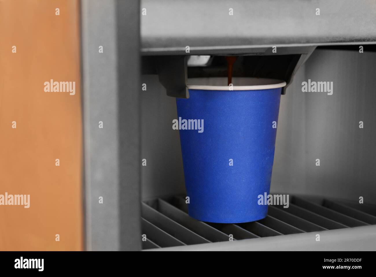 Vending machine pouring coffee in paper cup, closeup Stock Photo - Alamy