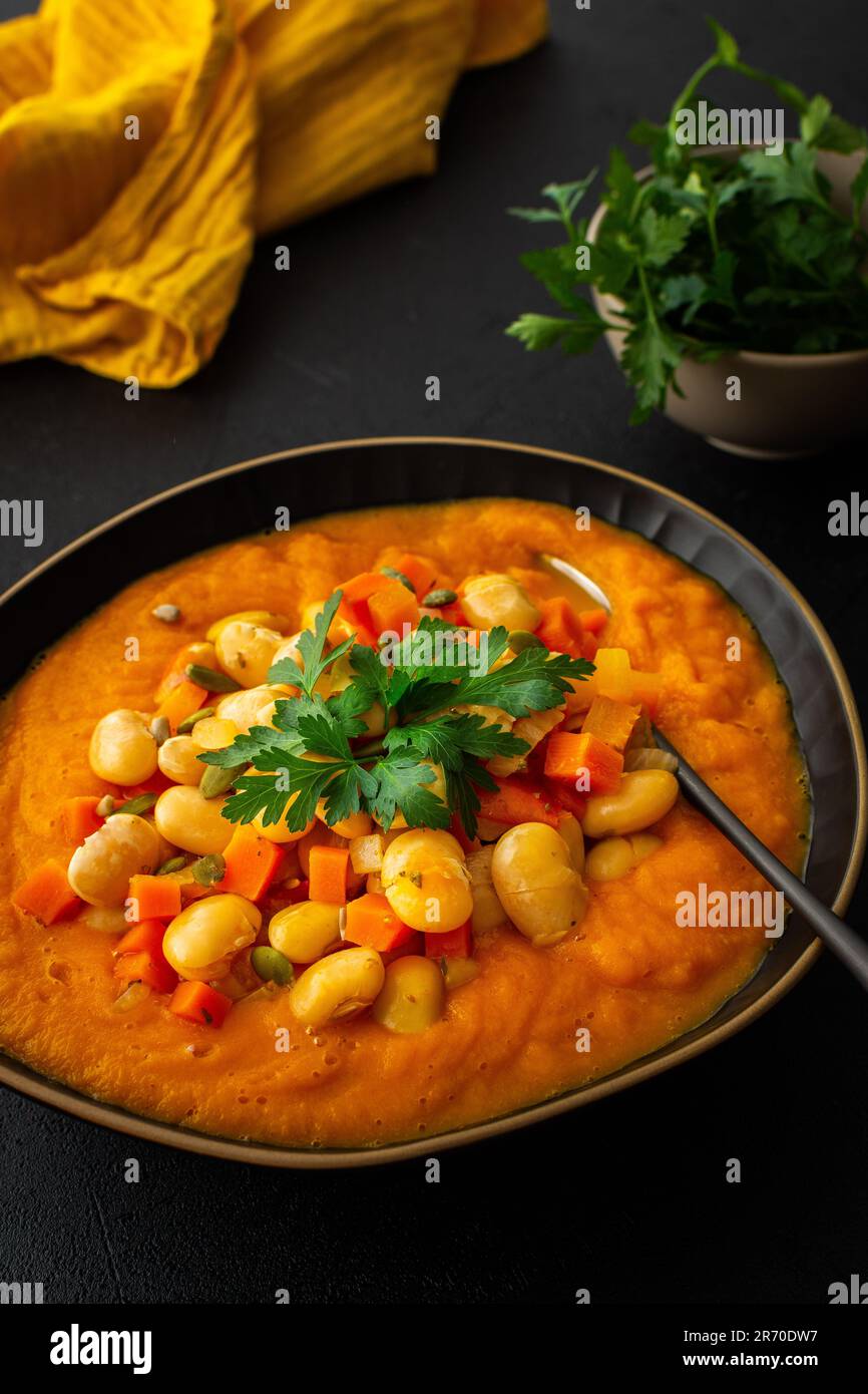 Healthy lunches, tomato and carrot puree soup, beans with pumpkin seeds
