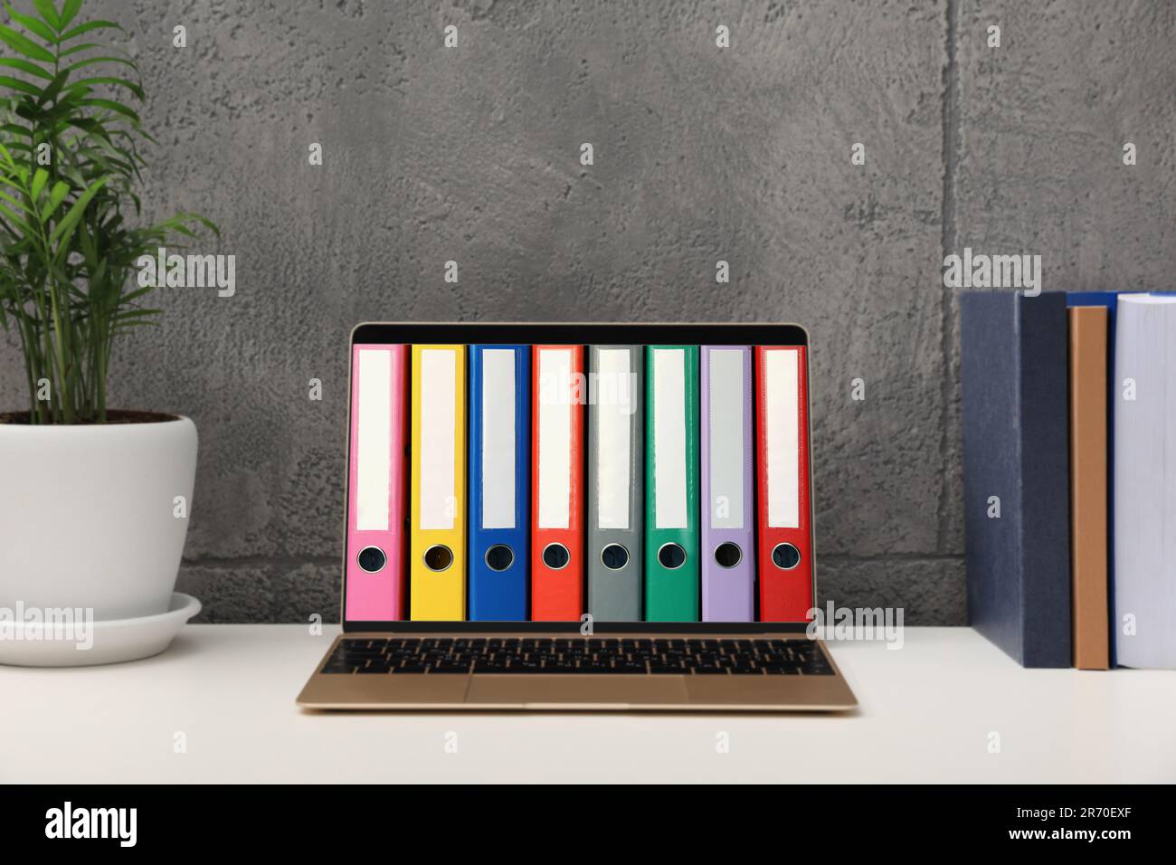 Store and organize information. Modern laptop with hardcover office
