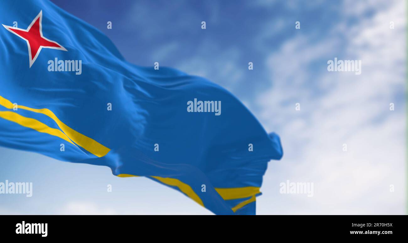 Flag of Aruba waving in the wind on a clear day. Light blue field, 2
