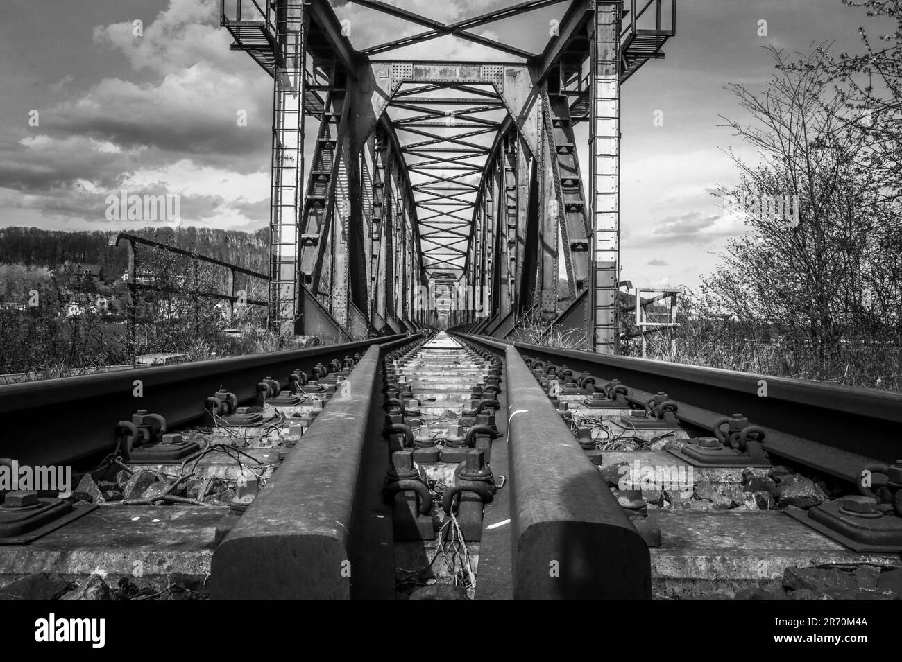 railway tracks with a iron bridge Stock Photo