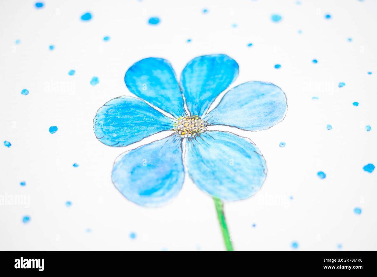 Blue flower and blue dots on white paper painted with blue watercolor. Stock Photo