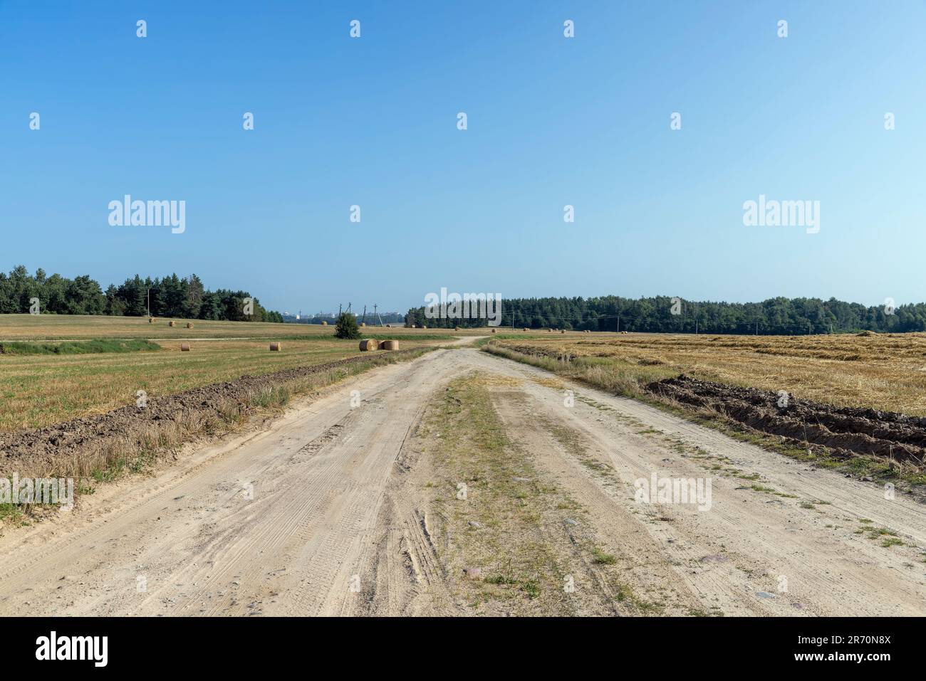 Rural road for cars and transport, ruts and traces of cars on a sandy ...