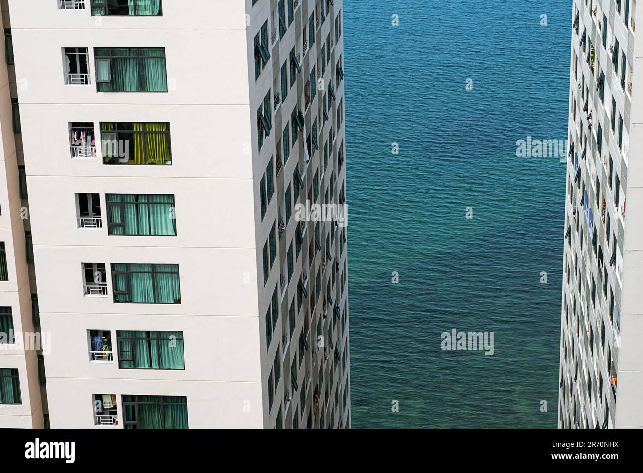 Modern multi storey residential buildings on seaside. High rise ... - Seaside High-Rise Condos
