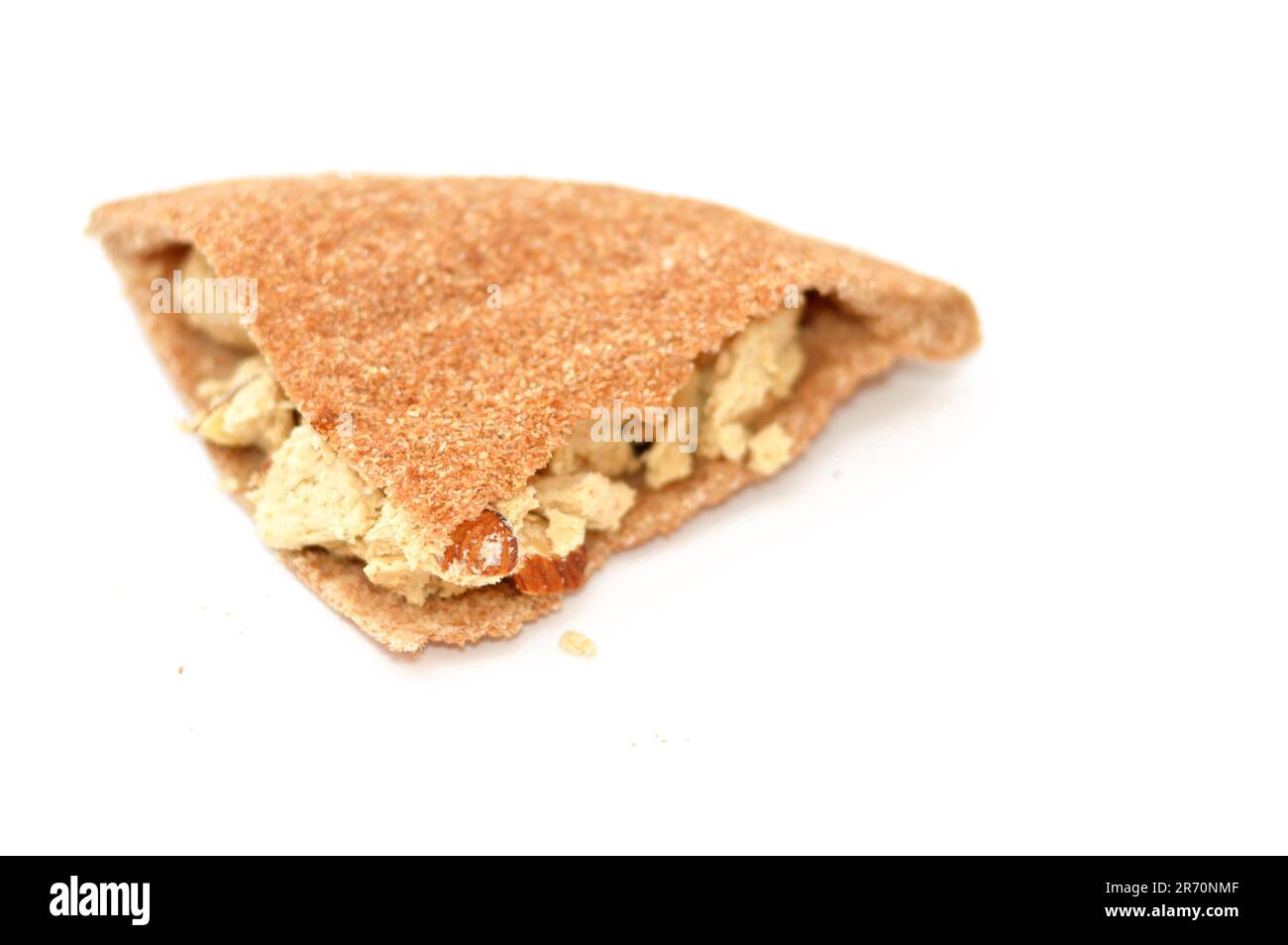 Traditional tahini halva with almonds or Halawa Tahiniya in a Brown