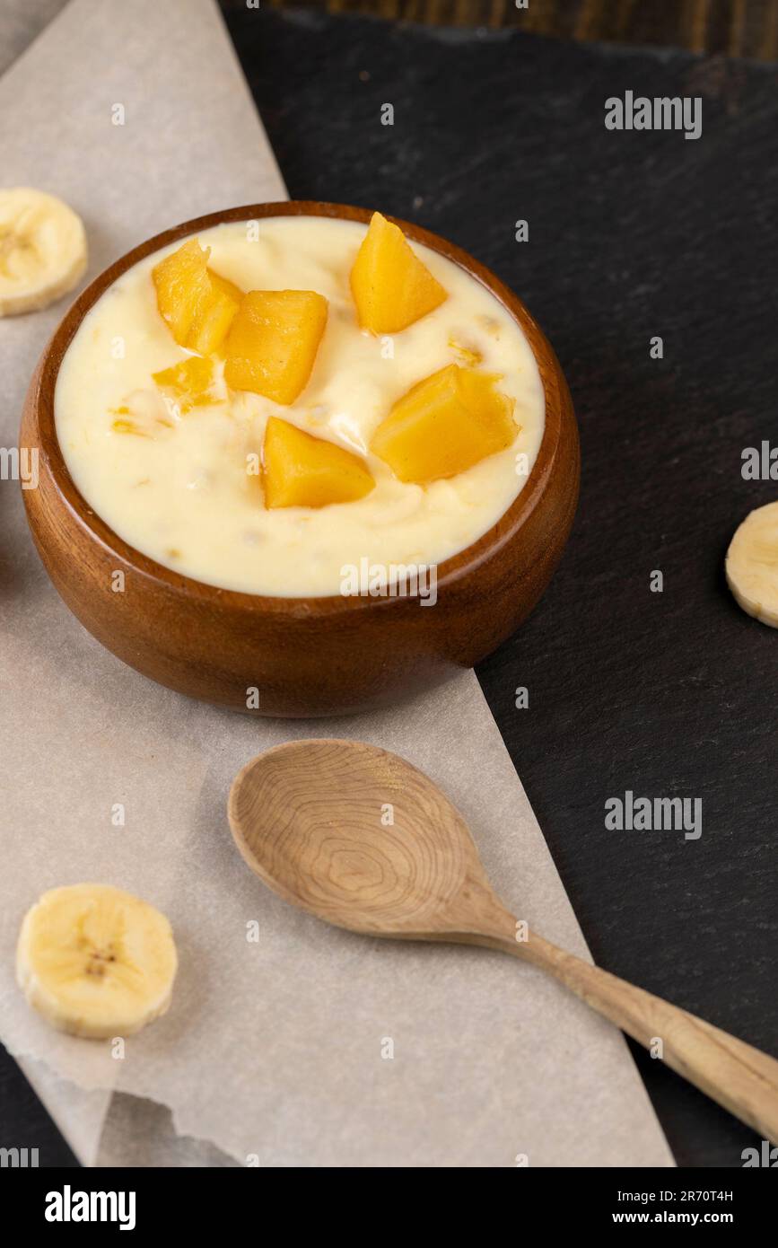 Natural Banana Yogurt Of Yellow Color With The Addition Of Pieces Of 
