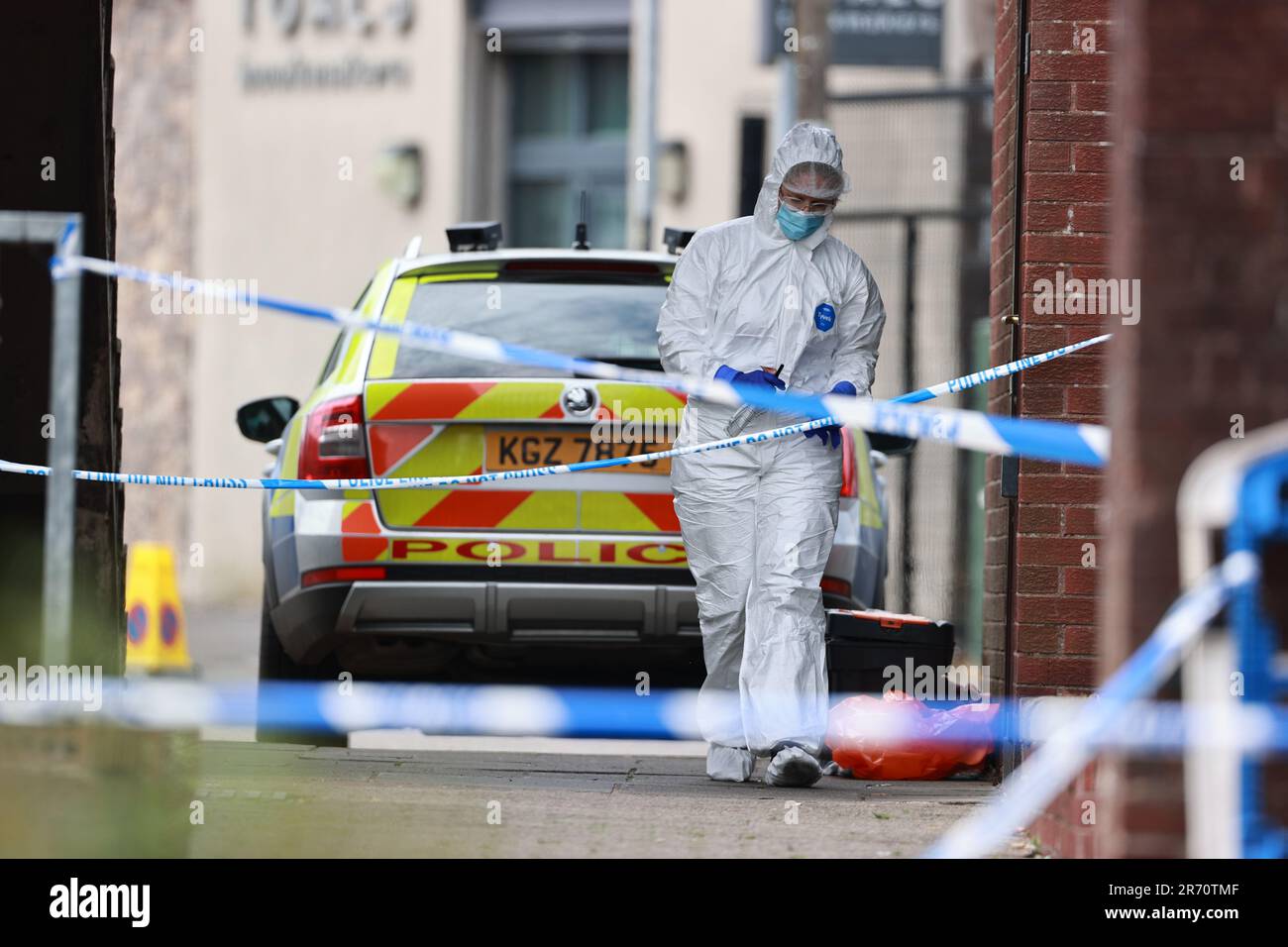 A police forensics officer at a property on James Street in Ballymena, Co Antrim, following the launch of a murder inquiry on Sunday after suspected human remains were found during the search for Chloe Mitchell, who was last seen on CCTV in the early hours of June 3 in Ballymena town centre. Brandon John Rainey, 26, of James Street in Ballymena appeared via video link at Ballymena Magistrates' Court, charged with the murder of 21-year-old Chloe. Picture date: Monday June 12, 2023. Stock Photo