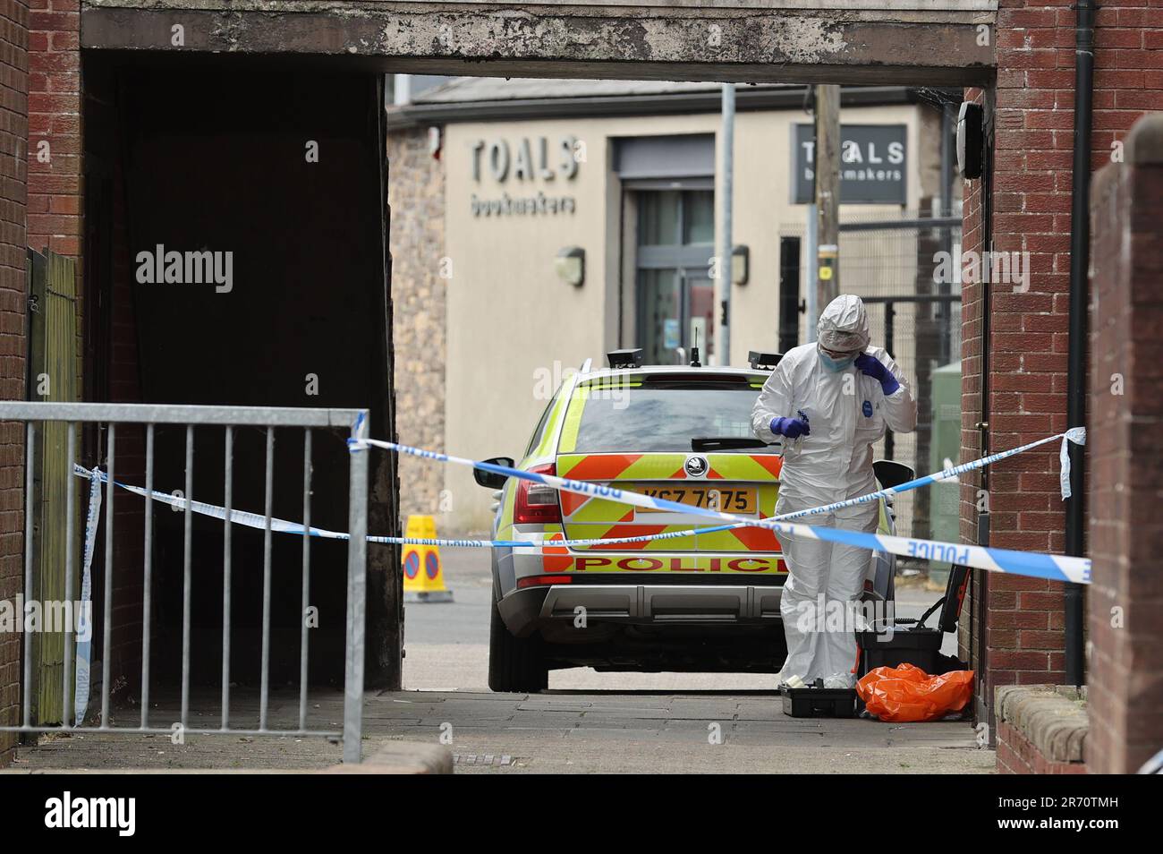 A police forensics officer at a property on James Street in Ballymena, Co Antrim, following the launch of a murder inquiry on Sunday after suspected human remains were found during the search for Chloe Mitchell, who was last seen on CCTV in the early hours of June 3 in Ballymena town centre. Brandon John Rainey, 26, of James Street in Ballymena appeared via video link at Ballymena Magistrates' Court, charged with the murder of 21-year-old Chloe. Picture date: Monday June 12, 2023. Stock Photo