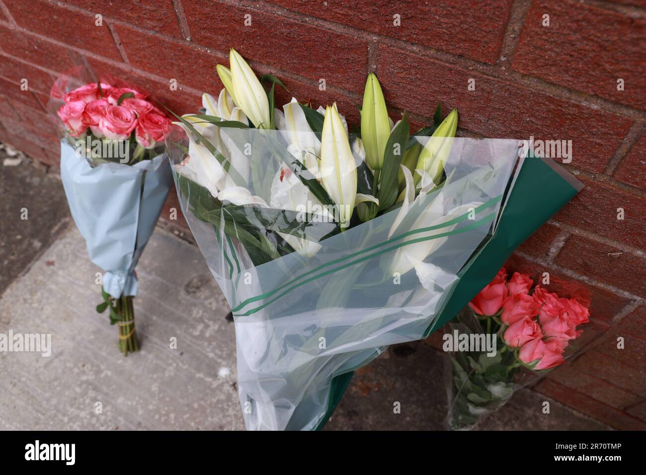 Flowers at the scene on James Street in Ballymena, Co Antrim, following the launch of murder inquiry on Sunday after suspected human remains were found during the search for Chloe Mitchell, who was last seen on CCTV in the early hours of June 3 in Ballymena town centre. Brandon John Rainey, 26, of James Street in Ballymena appeared via video link at Ballymena Magistrates' Court, charged with the murder of 21-year-old Chloe. Picture date: Monday June 12, 2023. Stock Photo