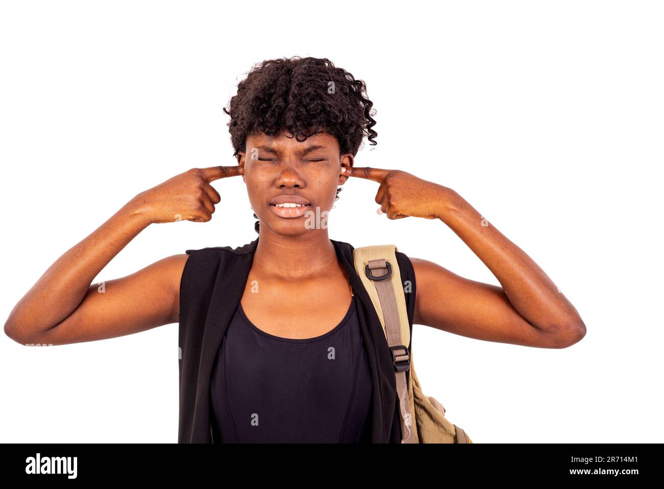 young student girl with backpack standing on white background covering ...