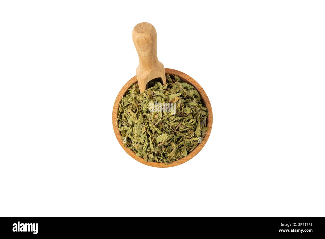 Dried leaves o Lemon verbena in latin Aloysia citrodora in wooden bowl and scoop isolated on white background. Medicinal herb. Lemon verbena leaf extr Stock Photo