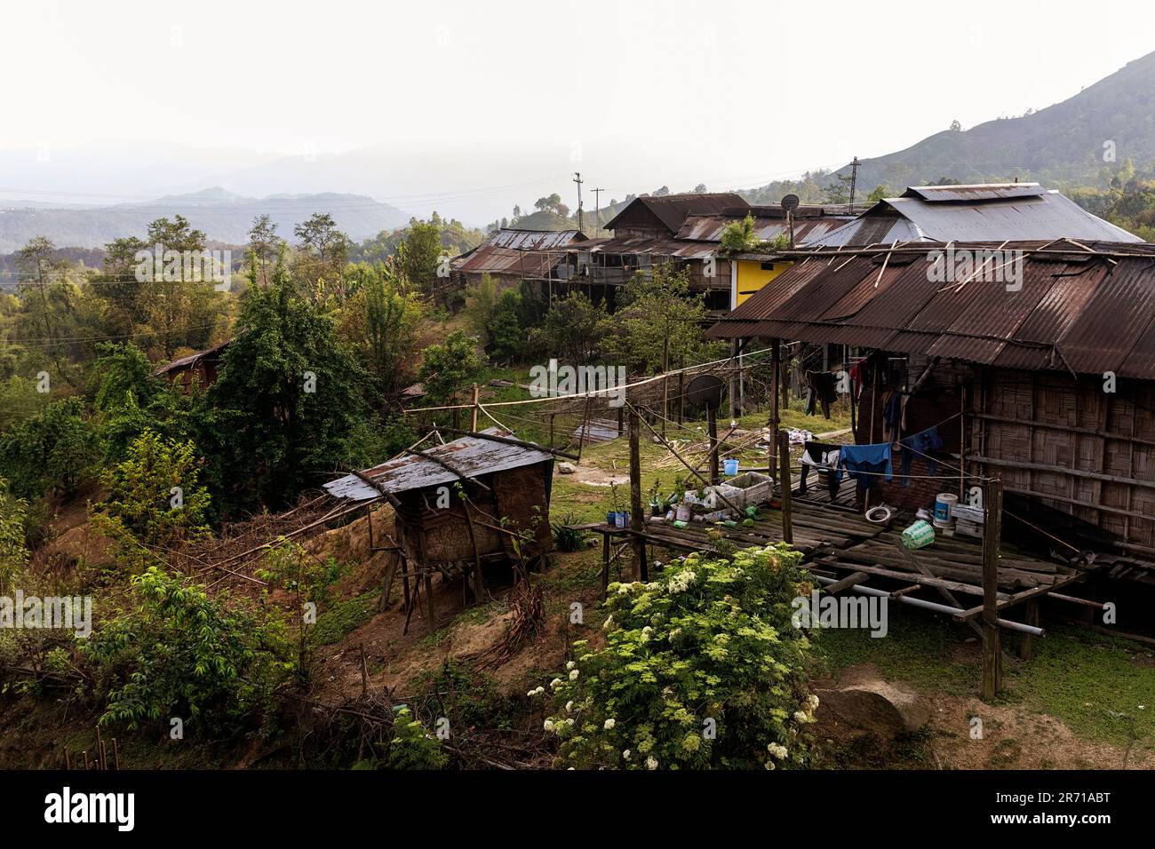 Traditional wooden houses made from bamboo of a Nyishi tribe in a small ...