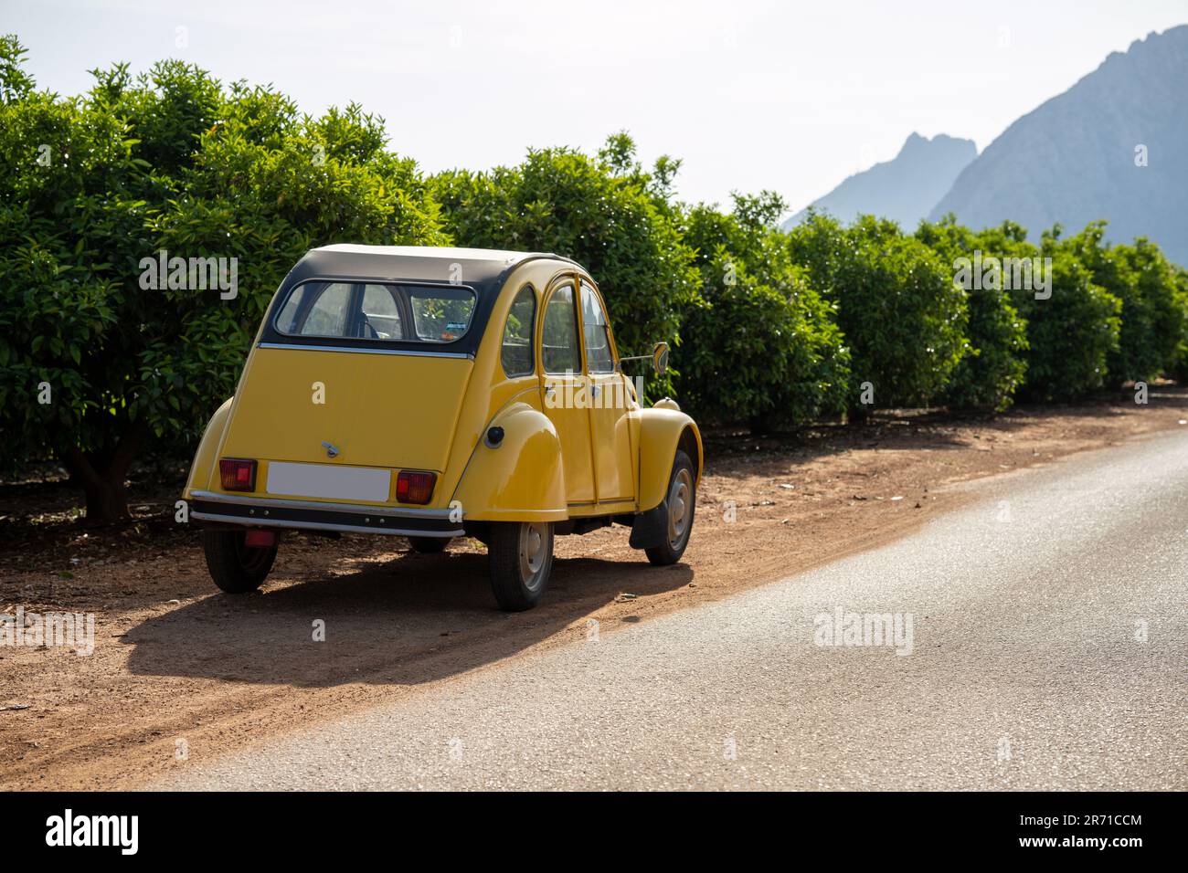 Classic Deux Chevaux Citroën 2CV in a Spanish landscape with vineyards Stock Photo