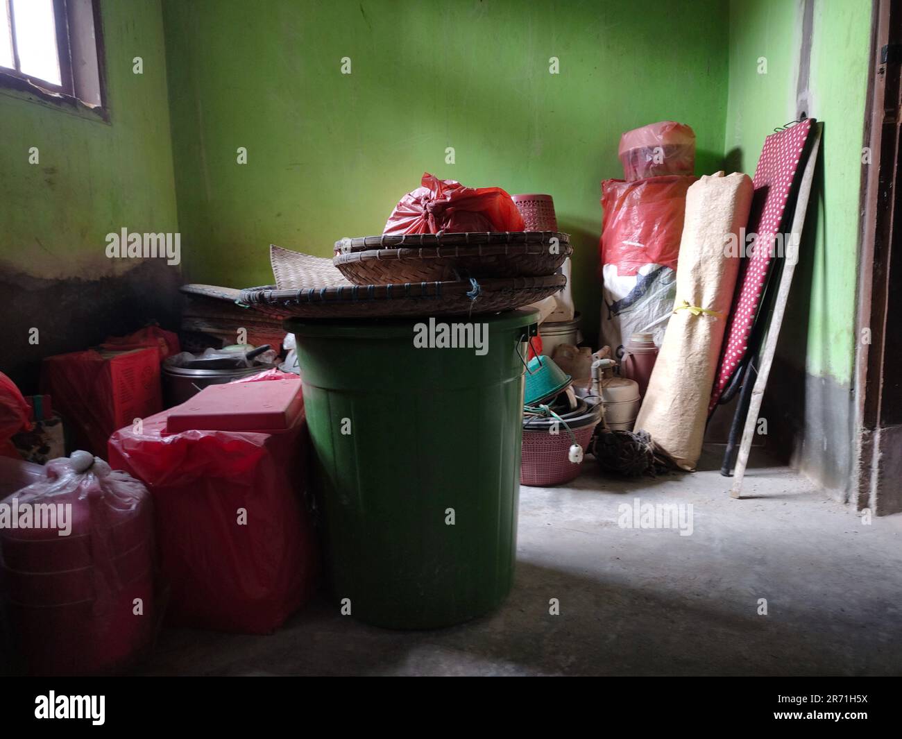 My grandma's house is being renovated so she is packing up her house furniture, like pots, buckets, pans etc Stock Photo