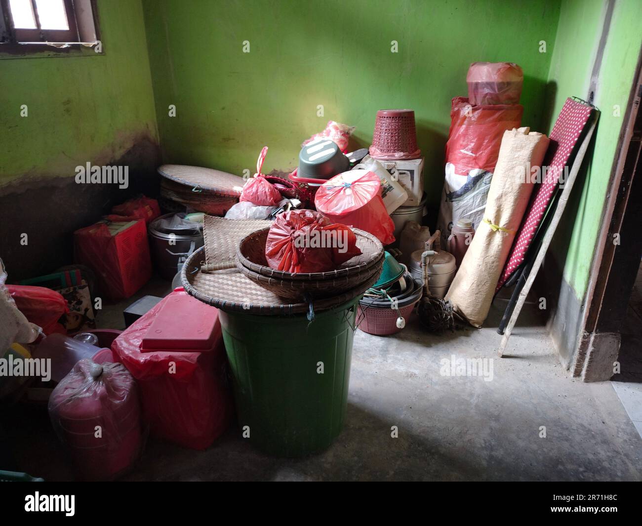 My grandma's house is being renovated so she is packing up her house furniture, like pots, buckets, pans etc Stock Photo