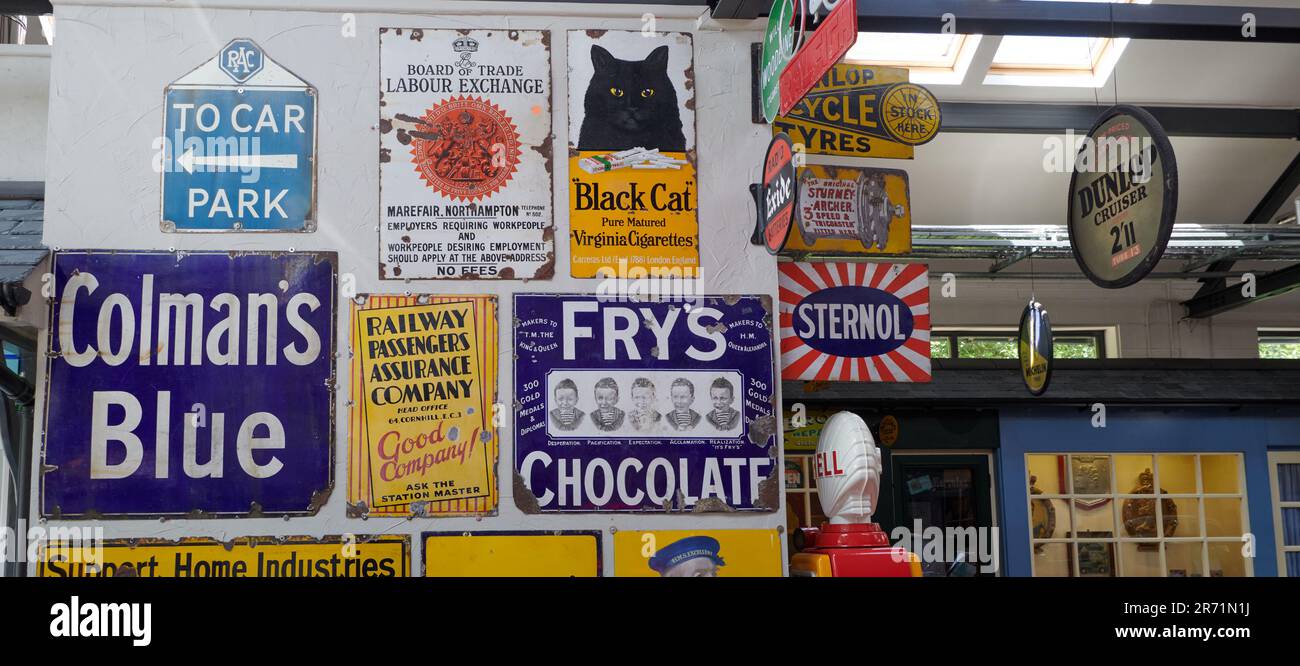 Enamel advertising signs on display Stock Photo Alamy