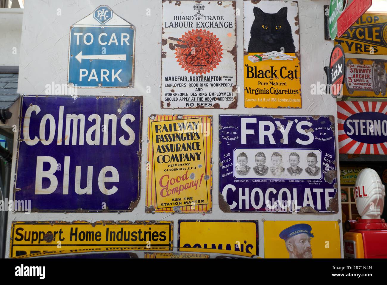 Enamel advertising signs on display Stock Photo Alamy