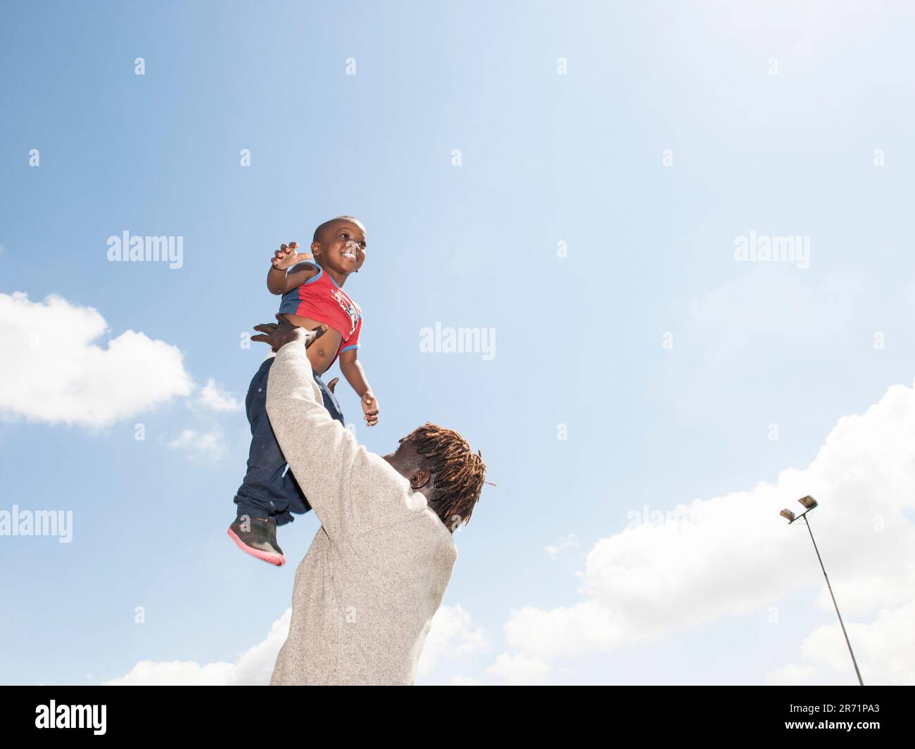 Father and son. immigrants. italy Stock Photo