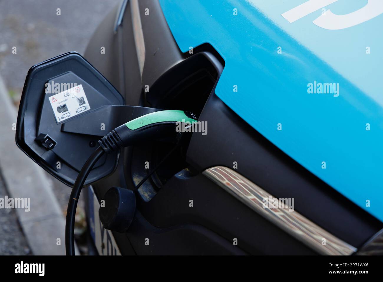 Transport, Road, Car, Renault supermarket electric delivery van being charged, Cranbrook, Kent, England. Stock Photo