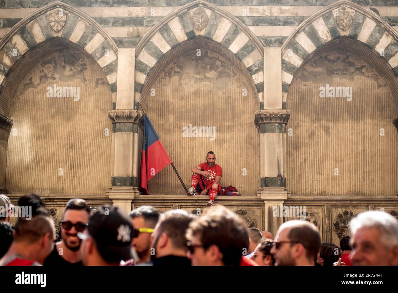 FLORENCE, ITALY, JUNE 11th - The captain of Rossi (Red team) looks down on  his audience in the procession before the semifinal begins.The game of  Calcio Storico Fiorentino is a challenge between
