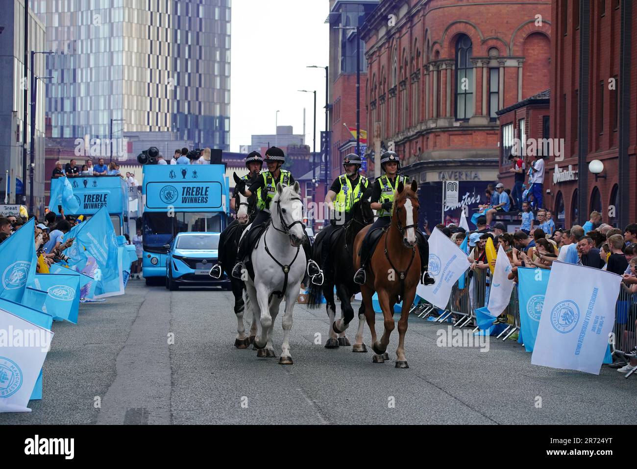 Mounted police officers patrol the route ahead of the Treble Parade in ...