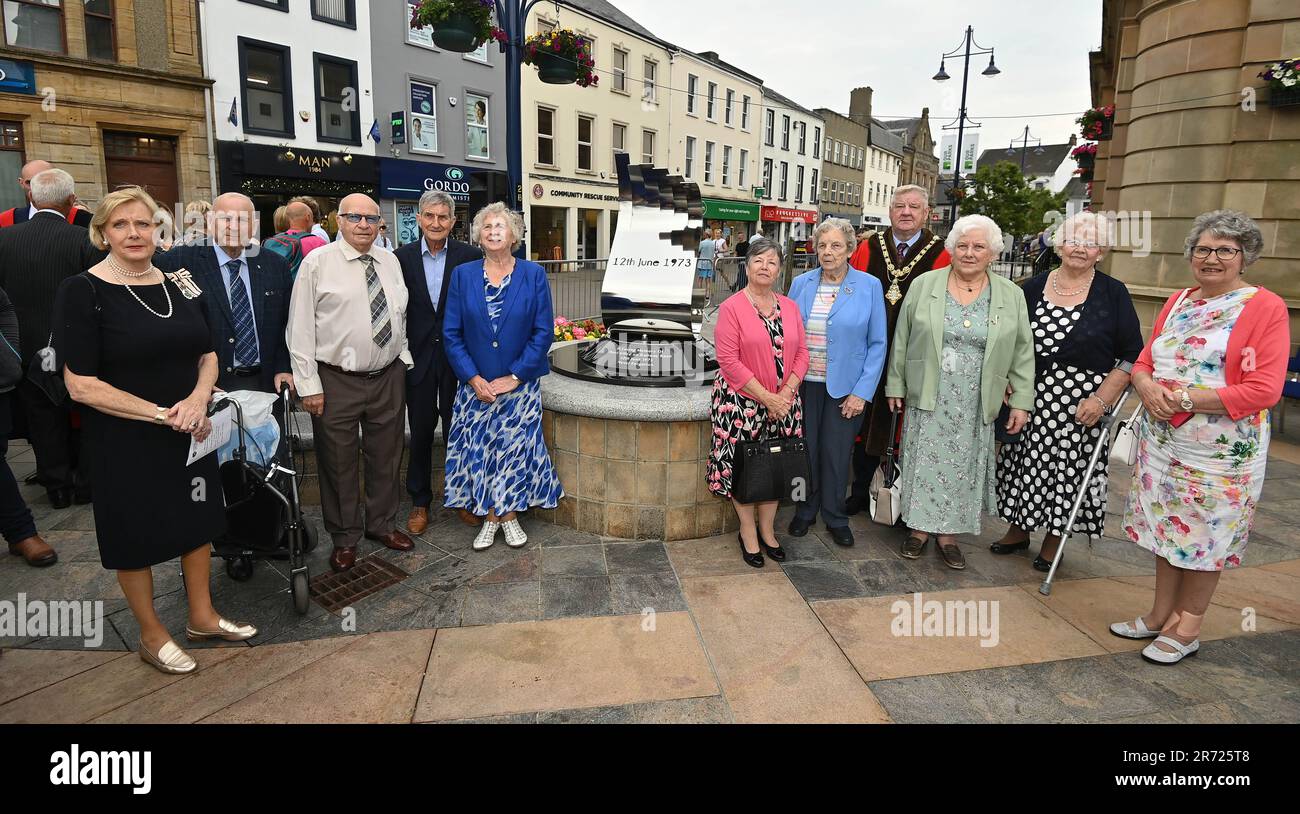 Relatives and dignitaries at the unveiling of a new memorial at