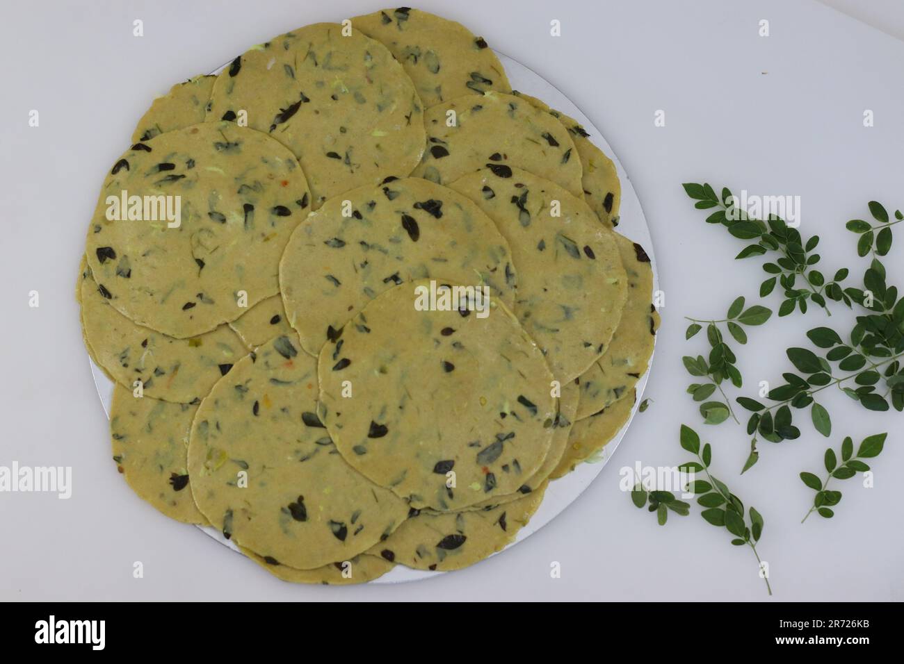 Ready to fry pressed poori made with whole wheat flour, mixed with