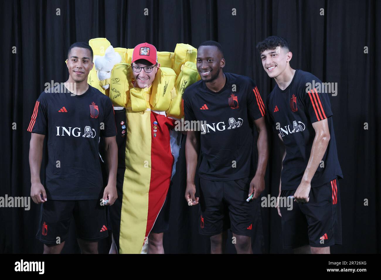 Tubize, Belgium. 12th June, 2023. Belgium's players pose with a fan dressed as a package of fries, after a training session of Belgian national soccer team Red Devils, Monday 12 June 2023, at the Royal Belgian Football Association RBFA's headquarters in Tubize, in preparation of the matches against Austria and Estonia later this month. BELGA PHOTO BRUNO FAHY Credit: Belga News Agency/Alamy Live News Stock Photo