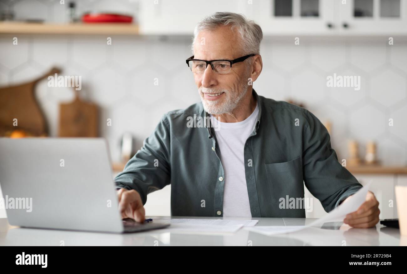 Grandfather working in kitchen hi-res stock photography and images - Alamy