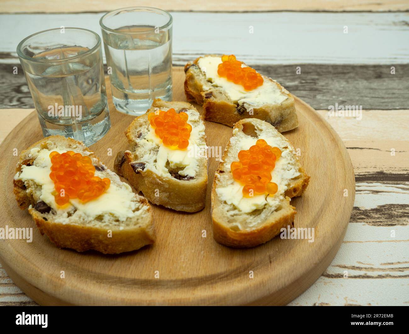 Potluck Roe Fish fish roe appetizers with glasses with vodka aside Stock Photo - Alamy