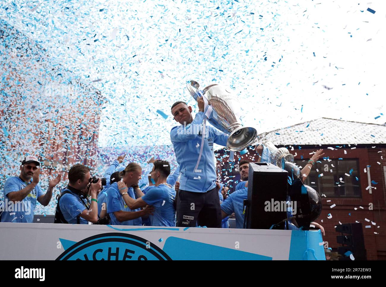 Manchester City's Phil Foden with the UEFA Champions League trophy during the Treble Parade in