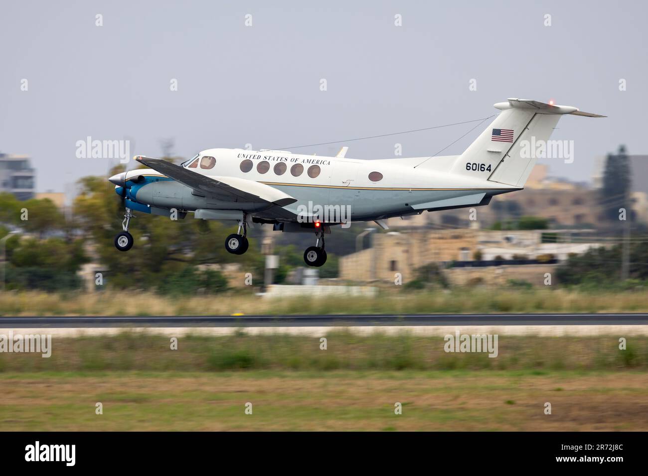 US Air Force (USAF) Beechcraft C-12C Huron (Reg: 76-0164) on finals runway 31 on a cloudy afternoon. Stock Photo