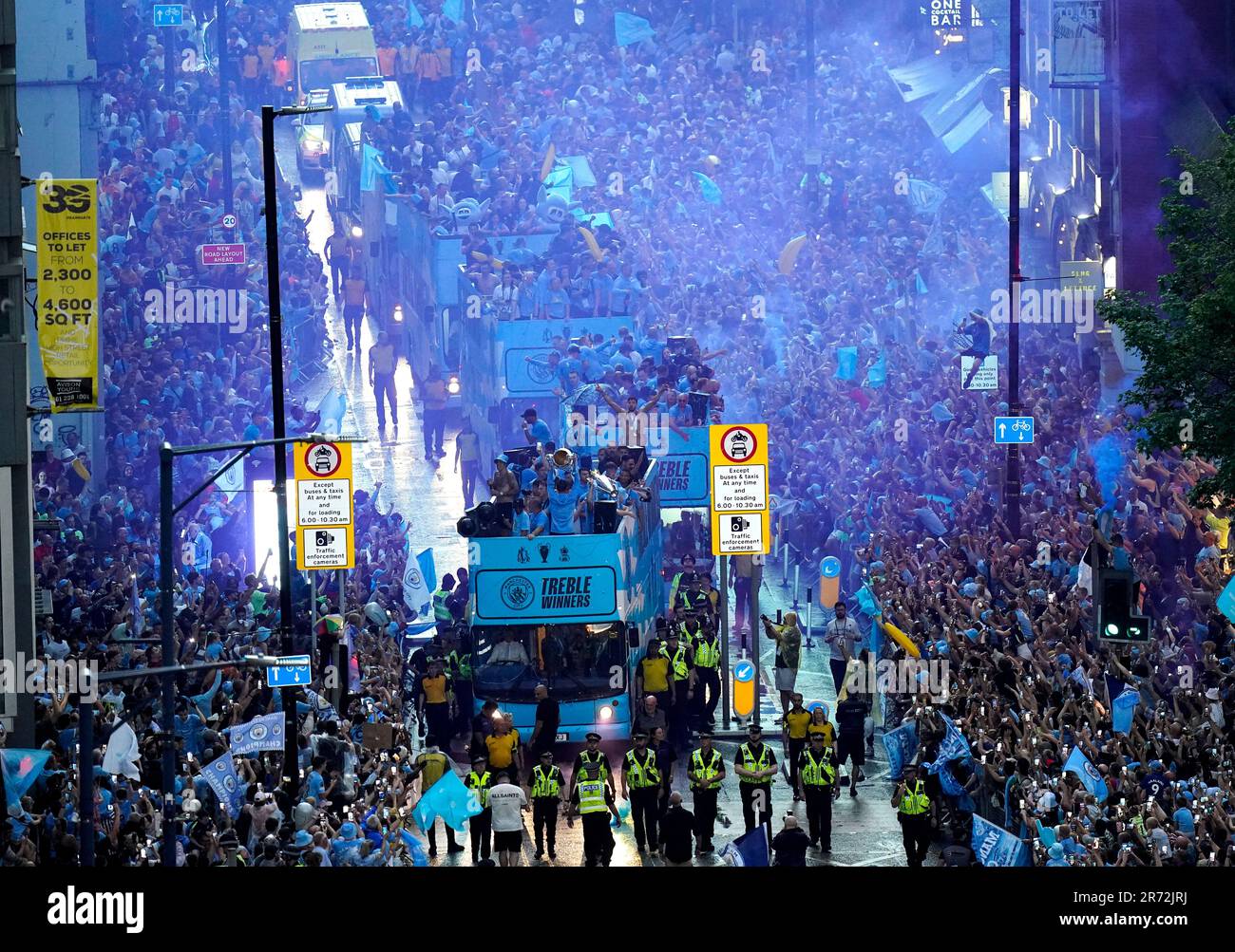 A general view of the team buses passing by fans during the Treble