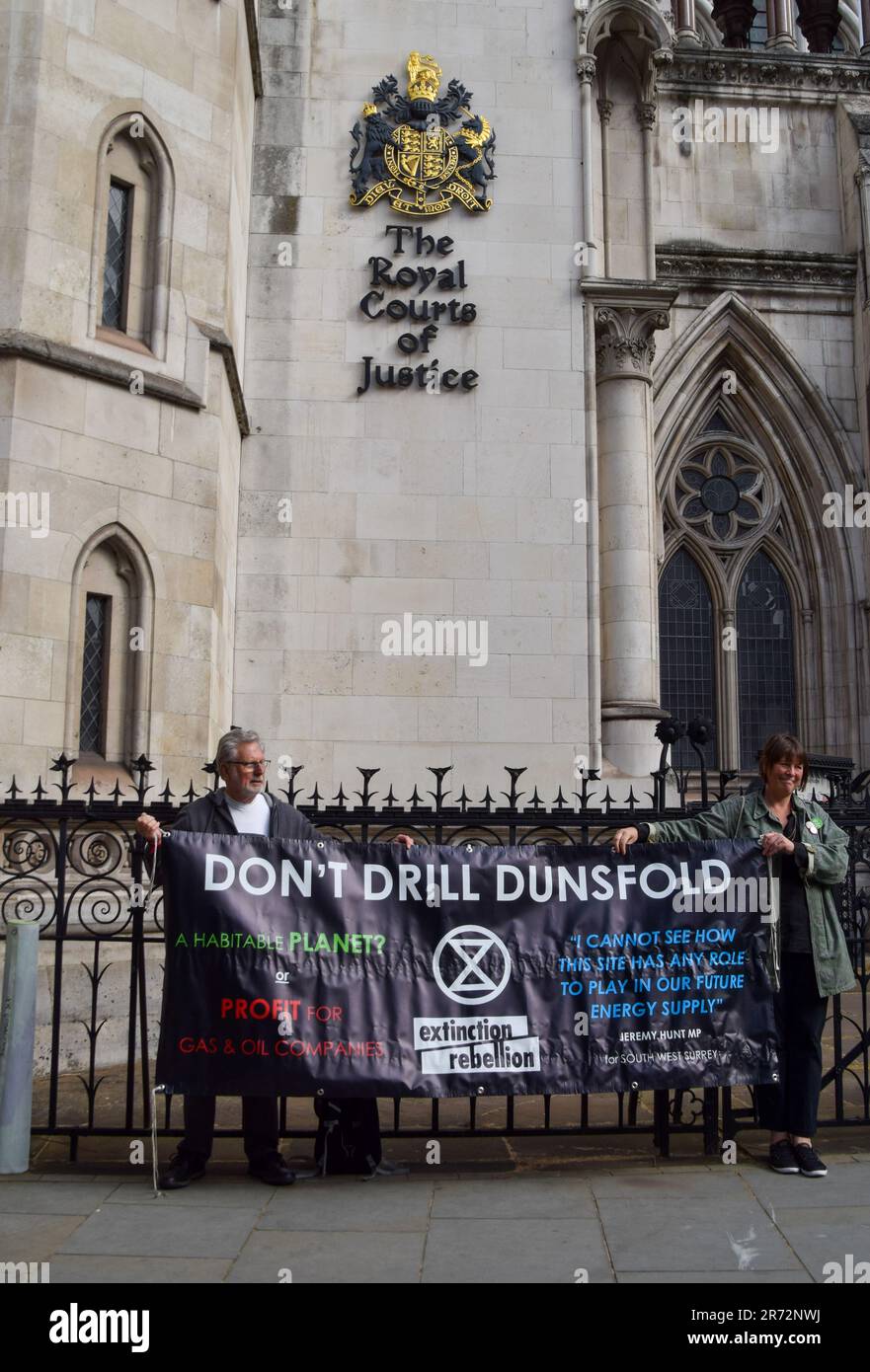 London, UK. 8th June 2023. Climate protesters gathered outside the Royal Courts of Justice during the judicial review of the planning permission for UK Oil & Gas to explore for fossil fuels near the village of Dunsfold. Stock Photo