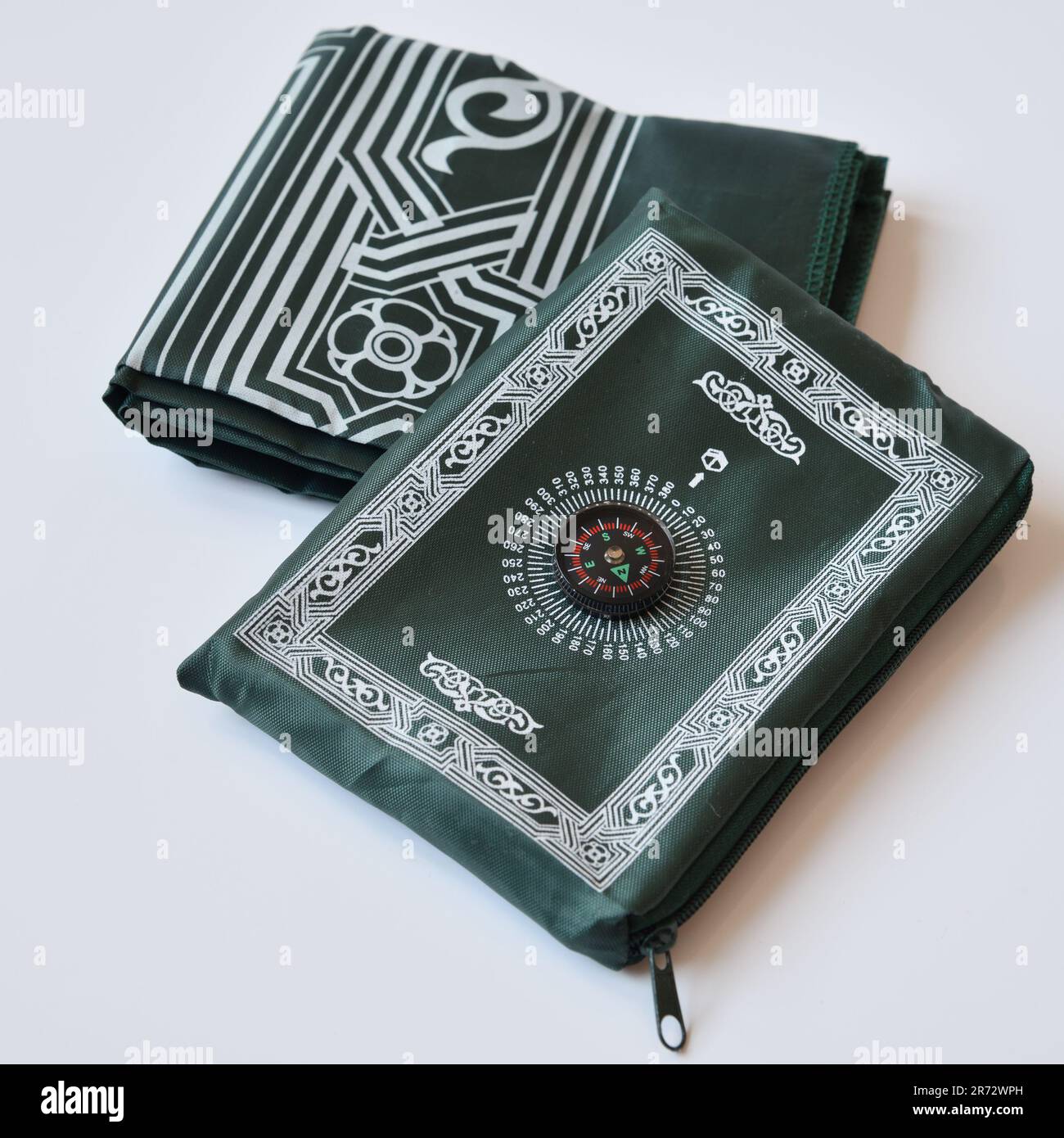 Portable Islamic Prayer Mat with a Compass to Point to Mecca Stock
