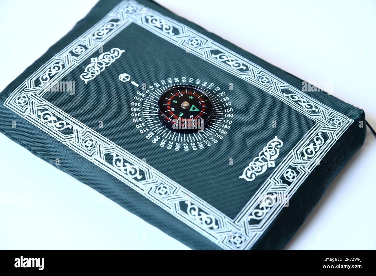 Portable Islamic Prayer Mat with a Compass to Point to Mecca Stock