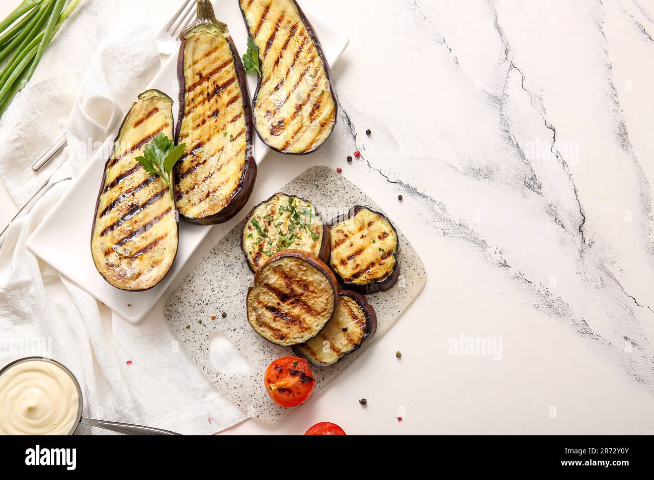 Composition with delicious grilled eggplants on light background Stock Photo
