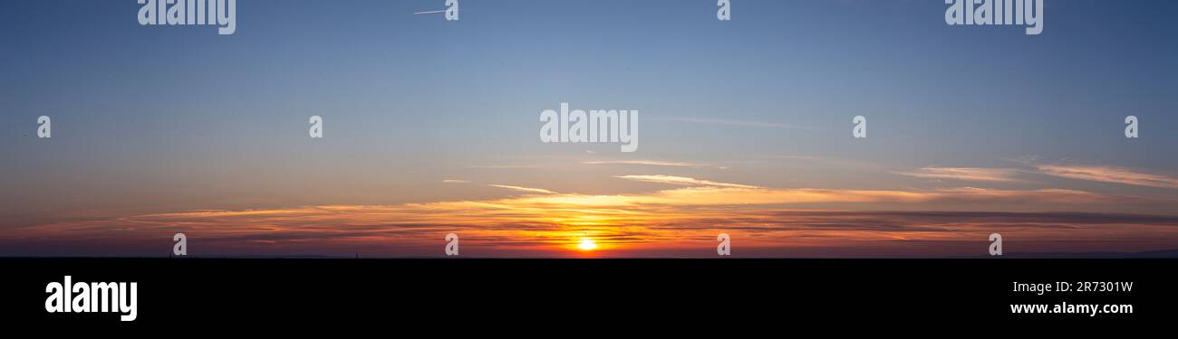 Picture of dramatic and colorful sky with sun during sunset in summer ...
