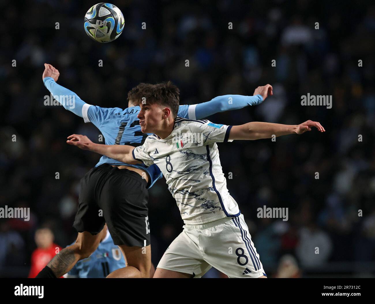 Italy's midfielder Cesare Casadei (R) heads for the ball with  Uruguay's defender Alan Matturro during the Argentina 2023 FIFA U-20 World Cup final football match between Uruguay and Italy at Diego Armando Maradona stadium in La Plata, Argentina, on June 11, 2023. Stock Photo