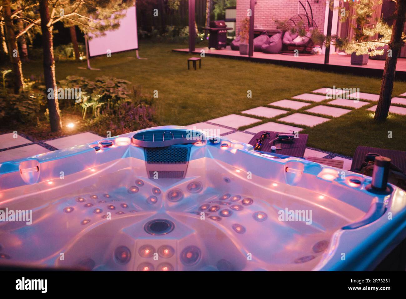 autonomous hot tub or jacuzzi with hot water and evening lighting Stock Photo Alamy