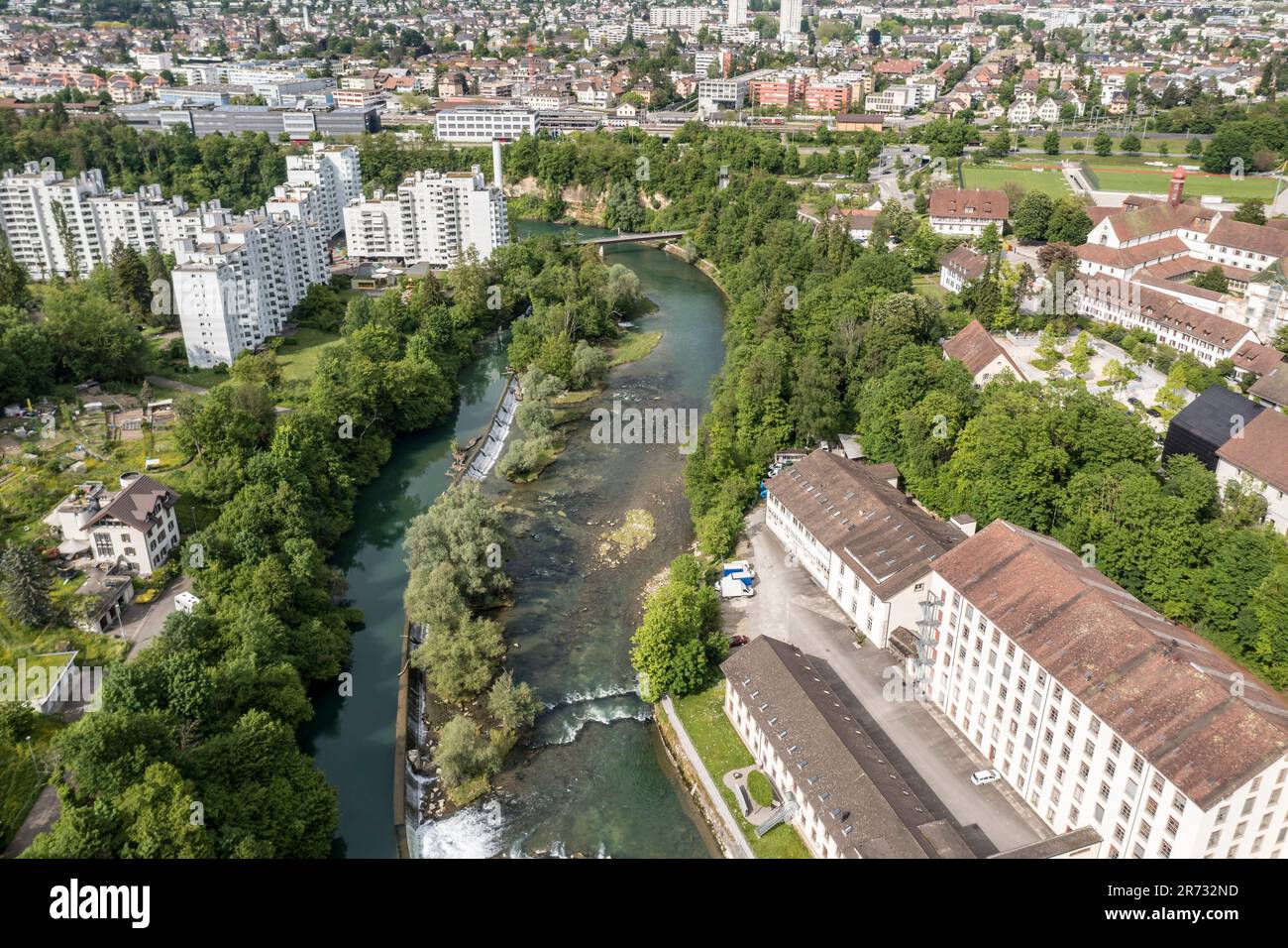 Apartment block and commercial buildings at the Limmat river, Wettingen peninsula, aerial view, city Baden, Aargau, Switzerland Stock Photo