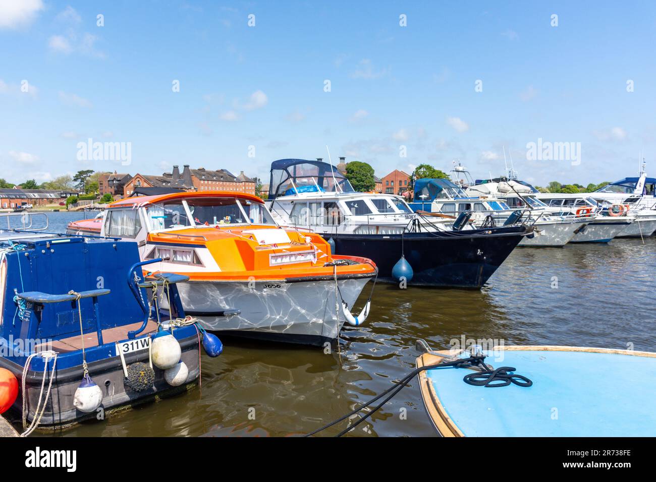 Boats moored in Oulton Broad Lake, Oulton Broad, Lowestoft, Suffolk, England, United Kingdom Stock Photo